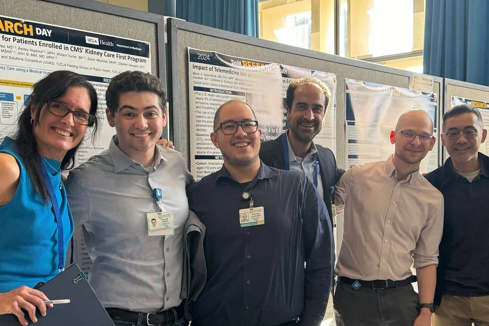 UVAS team members standing in front of posters presented at DGSOM