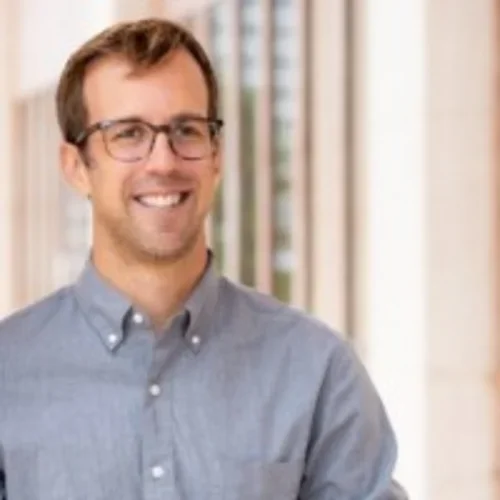 Headshot of Matt Chenoweth wearing glasses and smiling 