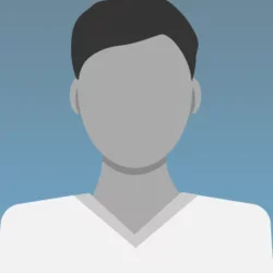 default profile icon representing a person without an uploaded image. Featuring a grey silhouette with dark hair and a blue background.