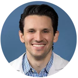 Headshot of Richard K. Leuchter, MD with a blue background