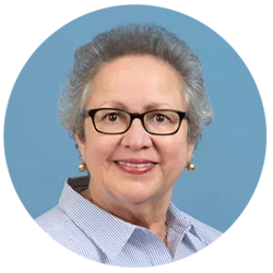 Headshot of Carmen E. Reyes with a blue background